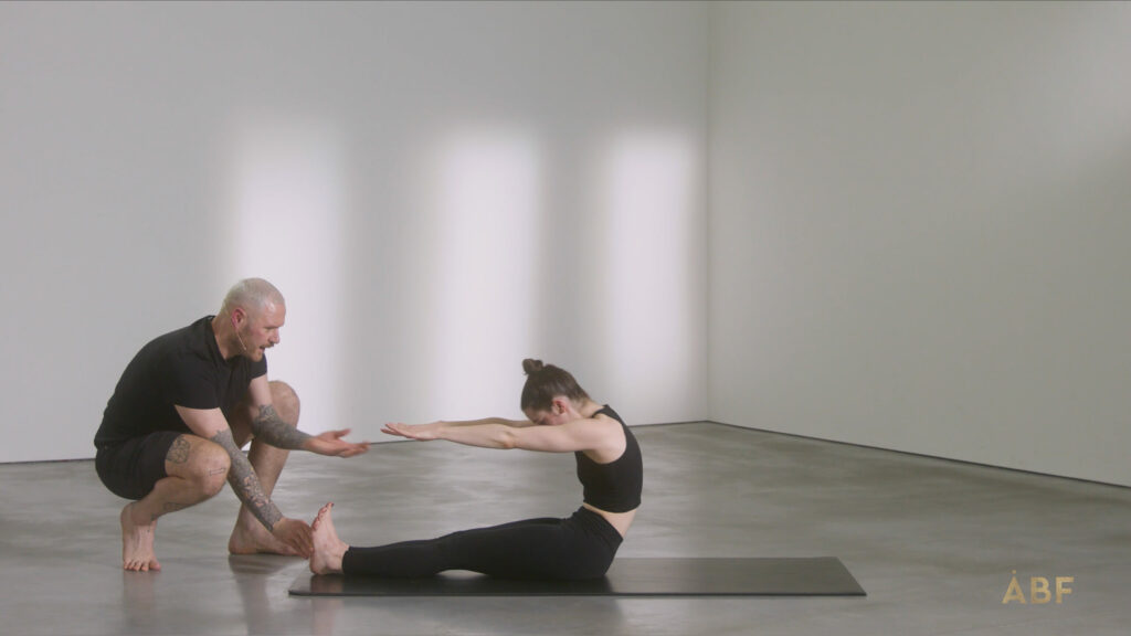 Man encouraging woman to stretch