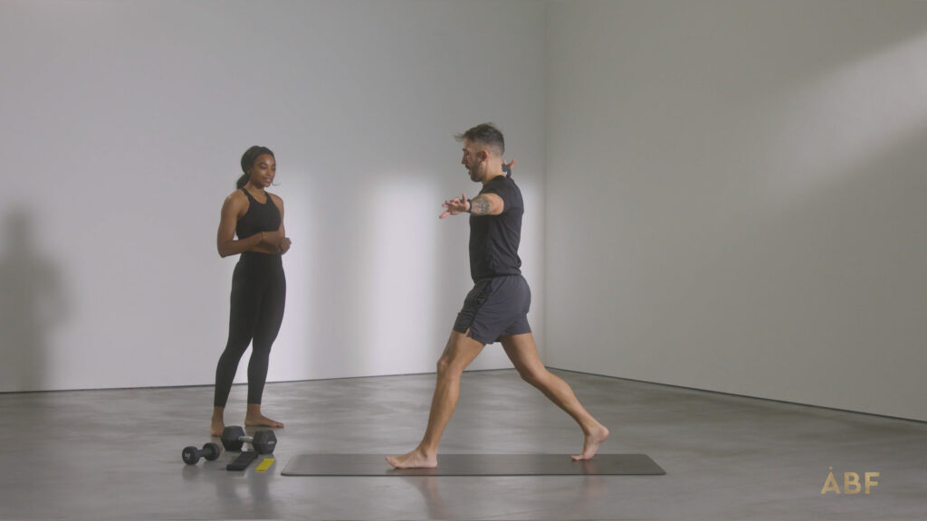 Man balancing on exercise mat