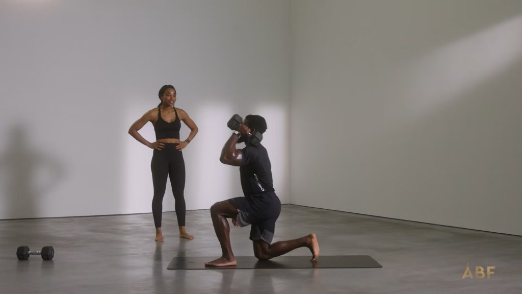 Man lifting weights with PT