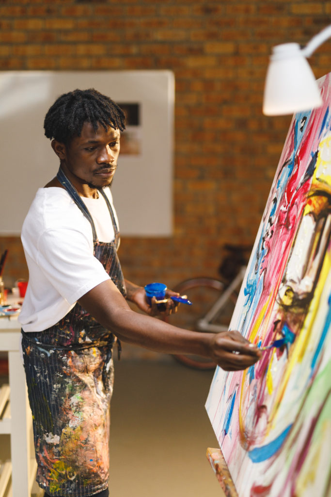 African,American,Male,Painter,At,Work,Painting,On,Canvas,In